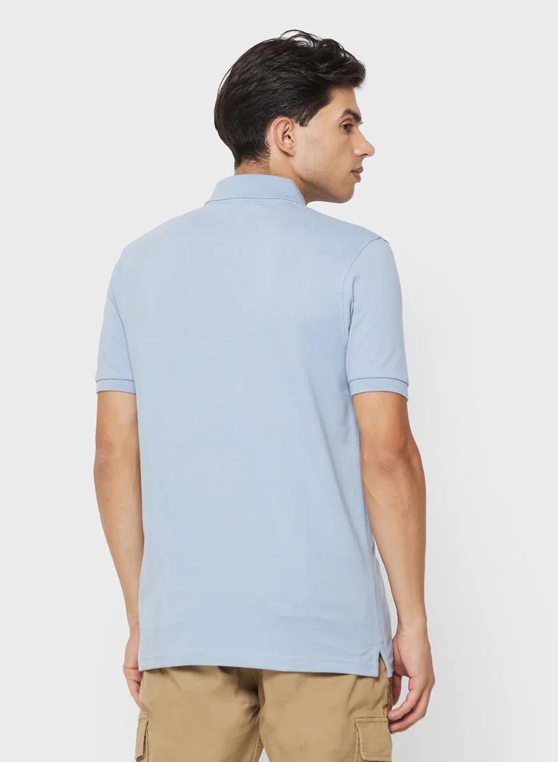 ريبوك قميص بولو مطرز بلهيب